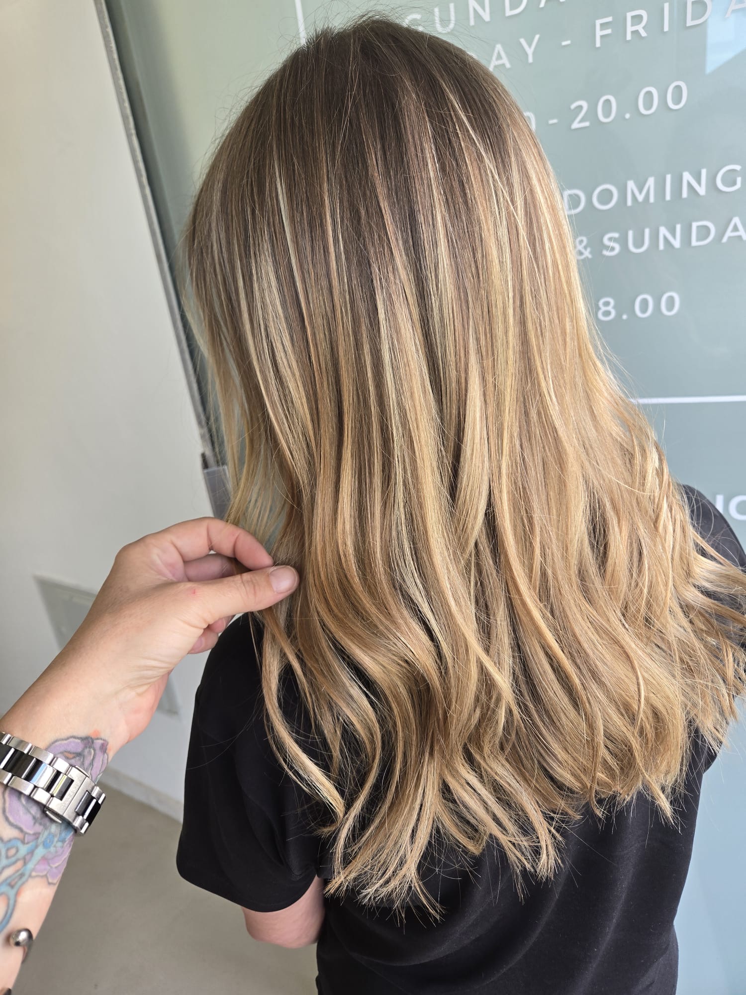 Client wearing balayage hair extensions